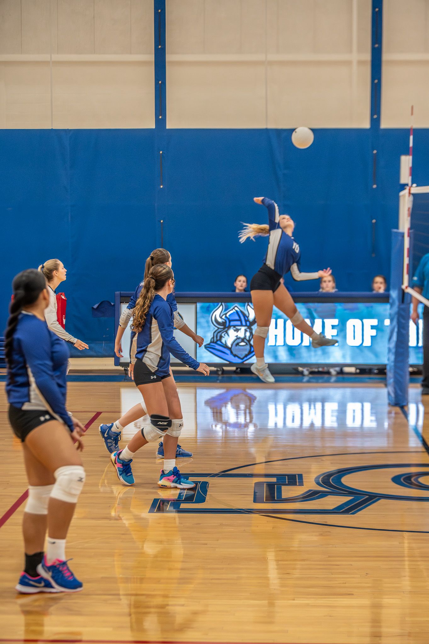 Volleyball player preparing to hit the ball during a serve